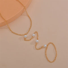 A stylish gold chain anklet embellished with pearls, combining classic beauty with modern design.