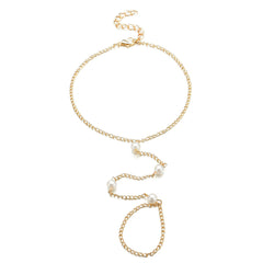 A refined gold chain anklet with pearls, representing a blend of luxury and contemporary fashion.