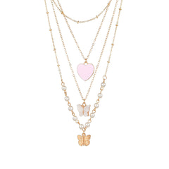 Elegant pink heart necklace with butterfly charm and pearls, designed in 18K gold plating for a sophisticated look.