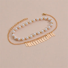 Gold chain bracelet featuring white pearls, designed with a chic gold chain for a fashionable look.