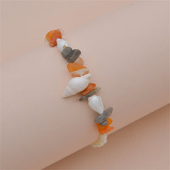 A chic anklet showcasing orange quartz and white shell pearl, beautifully crafted in 18K gold plating.