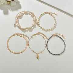 Three stylish gold and black anklets embellished with shells and pearls, part of a refined 18K gold-plated anklet set.