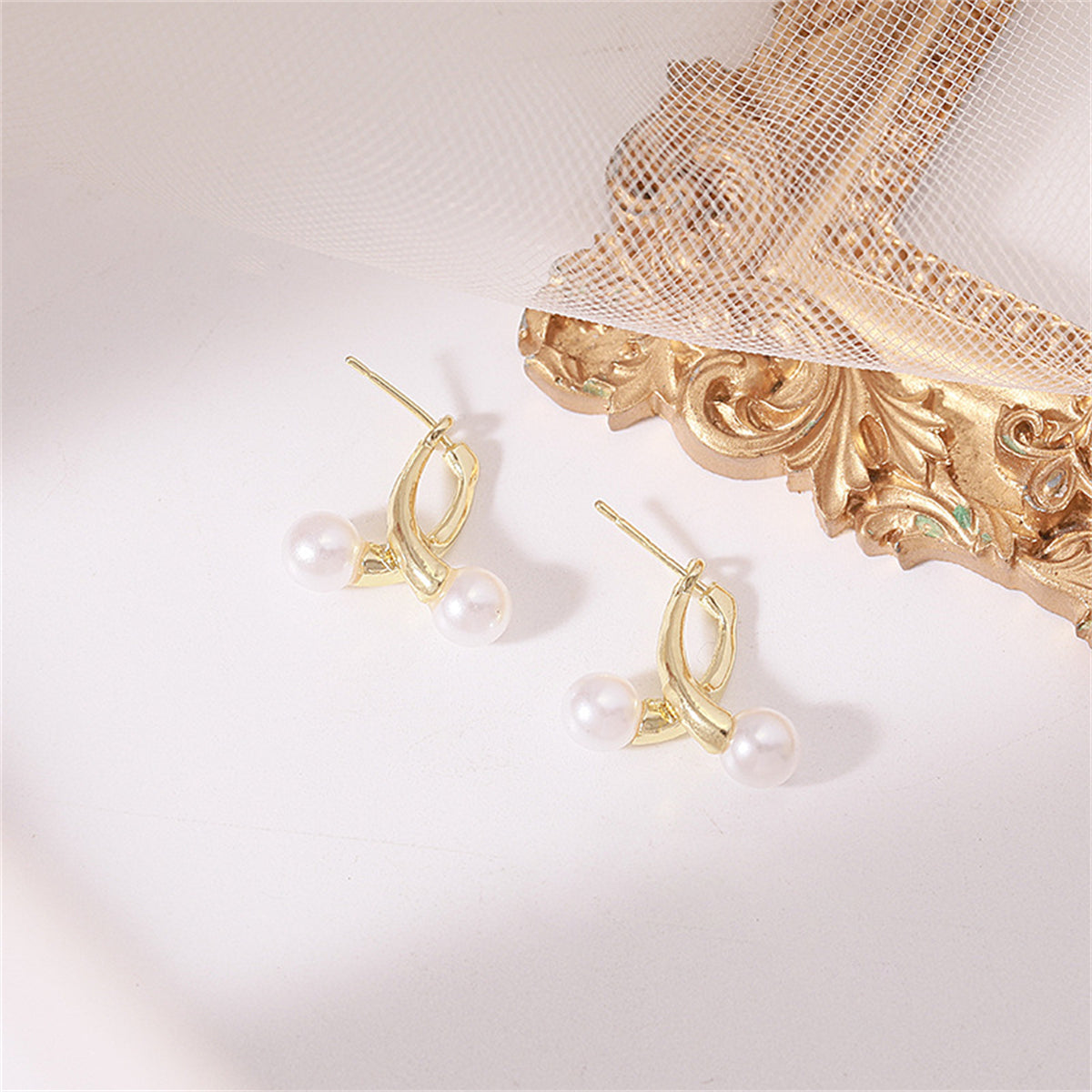 Pearl and 18K Gold-Plated Overlapping Ear Jackets, gold stud earrings for women, vintage-inspired design, styled look