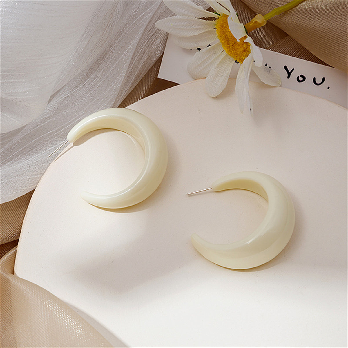 White Resin and Silver-Plated Crescent Huggie Earrings, silver huggie earrings, vintage-inspired design, detail close-up