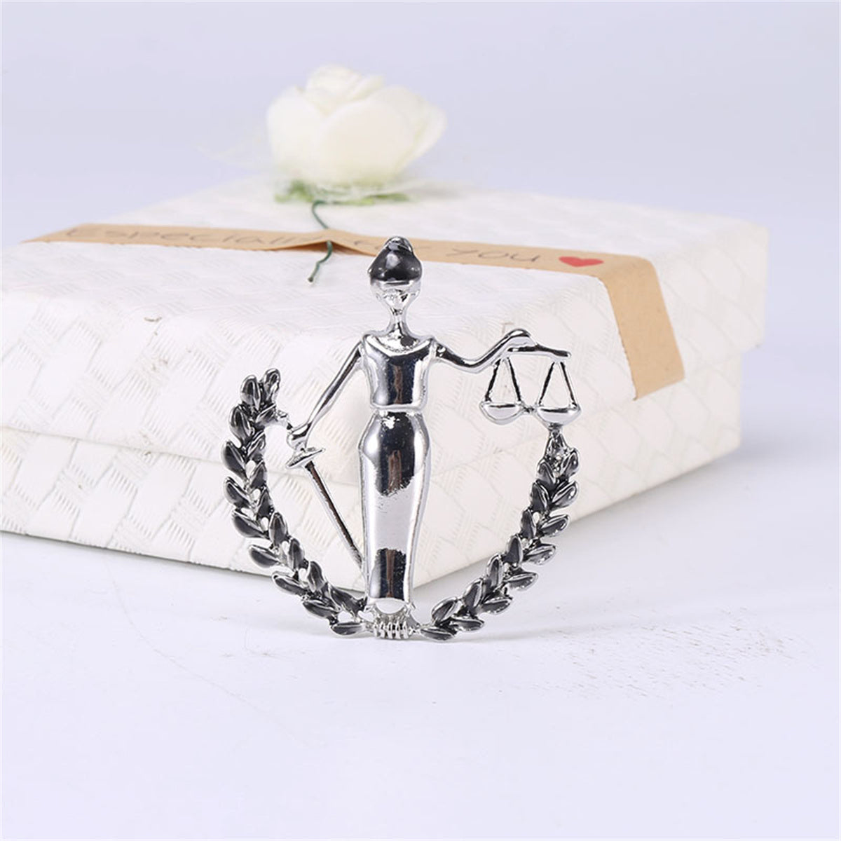 Black Enamel and Silver-Plated Libra Figure Brooch, silver brooch pin, everyday style, detail close-up