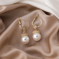 Elegant 18k gold-plated floral huggie earrings featuring white pearls and sparkling cubic zirconia crystals.