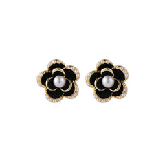 Elegant black and white flower earrings featuring diamonds, crafted in 18k gold-plated with pearl and black enamel accents.