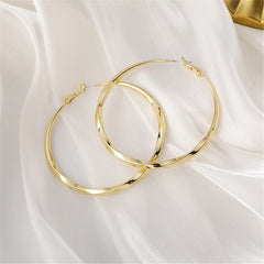 18K gold-plated twisted hoop earrings, featuring a stylish and elegant design perfect for any occasion.