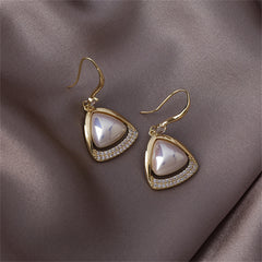 Gold-plated open-triangle drop earrings featuring white cubic zirconia stones and a pearl accent.