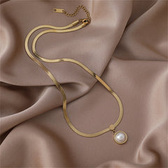 Elegant gold necklace featuring a pearl pendant on an 18K gold-plated snake chain.