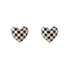 Charming black and white checkered heart earrings, crafted from enamel, perfect for adding a unique touch to your style.