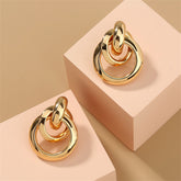 Elegant 18K gold-plated drop earrings featuring a stylish circular design, perfect for any occasion.