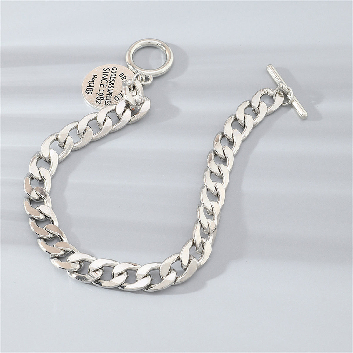 Silver-Plated 'Goods and Supplies' Curb Chain Toggle Bracelet, silver bracelet for women, lifestyle look