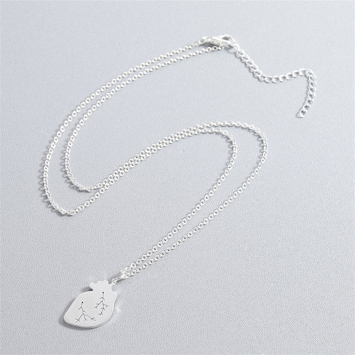 Silver-Plated Heart Pendant Necklace, silver pendant necklace for women, vintage-inspired design, side view