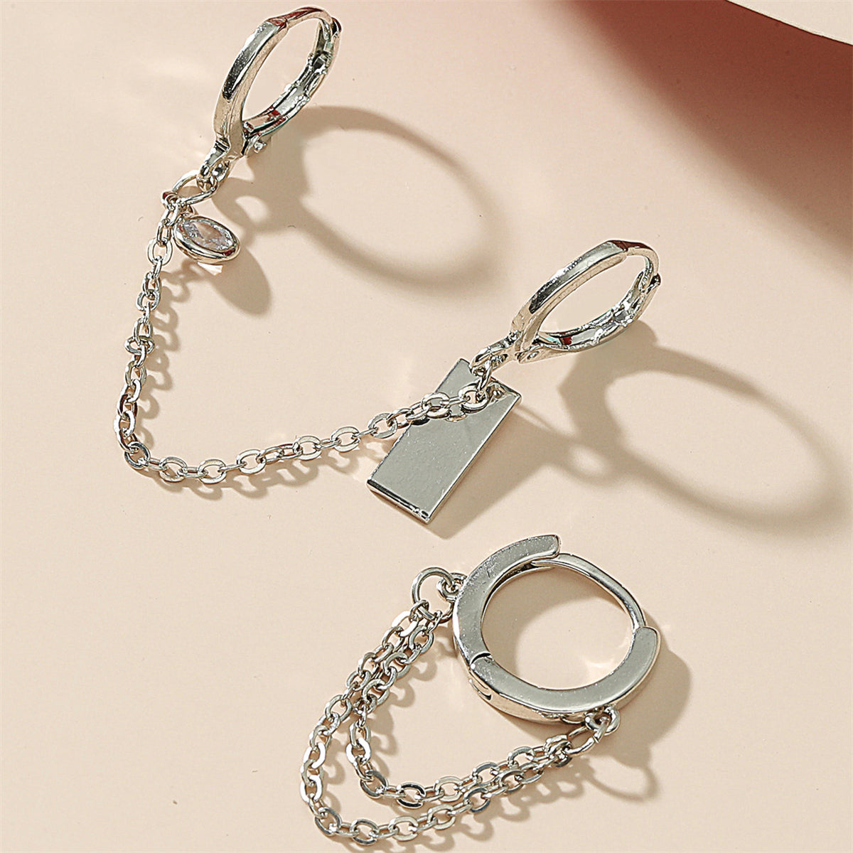 Cubic Zirconia and Silver-Plated Chain Huggie Earrings, silver huggie earrings, dainty minimalist design, lifestyle look