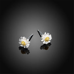 Elegant 18K gold-plated and sterling silver daisy stud earrings featuring white petals and vibrant yellow centers.