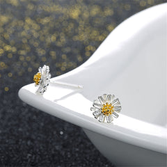 Delightful 18K gold-plated sterling silver earrings shaped like white daisies with bright yellow centers, perfect for any occasion.