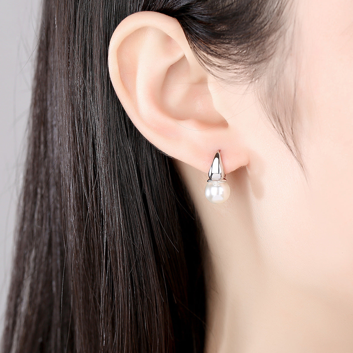Pearl and Silver-Plated Huggie Earrings, silver huggie earrings, vintage-inspired design, lifestyle look