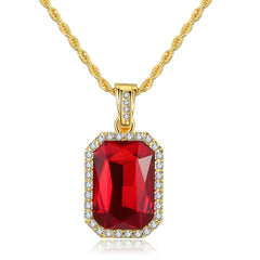 Striking red crystal pendant with diamond accents on a gold chain, offering a touch of elegance to any outfit.
