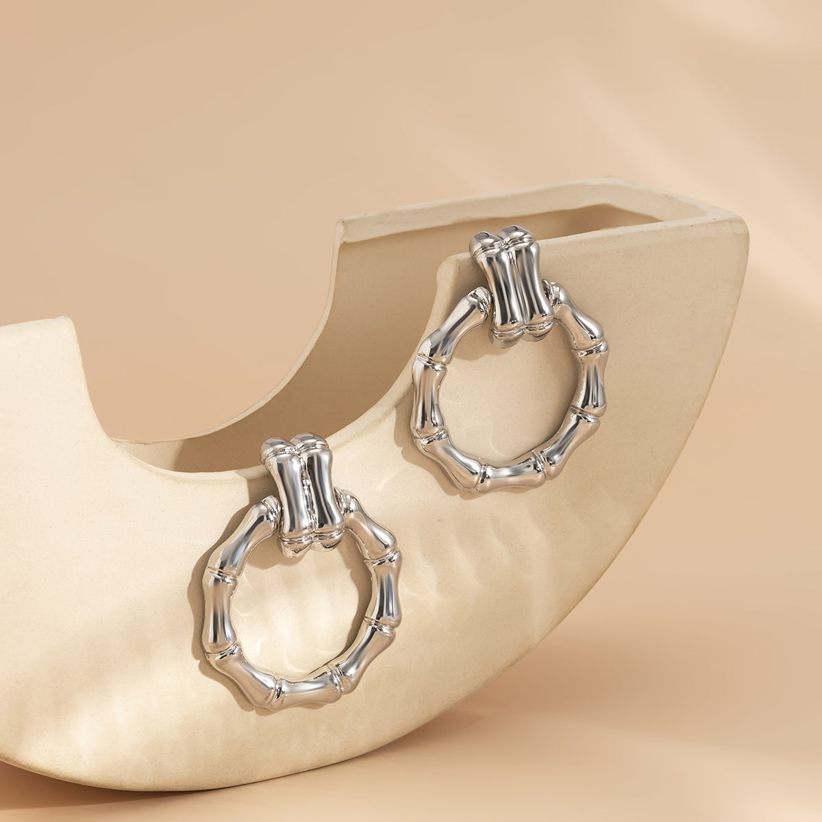 Silver-Plated Bamboo-Shaped Round Drop Earrings, silver drop earrings for women, vintage-inspired design, styled look