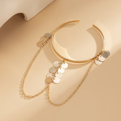 Luxurious 18K gold-plated disc chain arm cuff with coin embellishments, ideal for adding sophistication to your look.