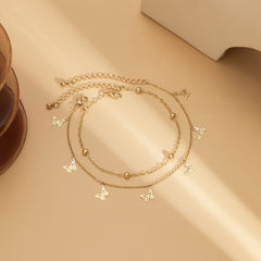 Beautifully crafted 18K gold-plated charm anklet with butterfly accents, ideal for a stylish and sophisticated look.