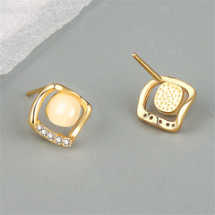 Chic 18K gold-plated earrings with white stones, featuring a unique rhombus design that adds sophistication to any outfit.