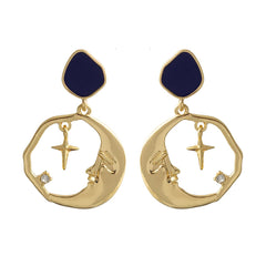 Elegant gold-plated earrings with crescent moon and cross design, adorned with a vibrant stone.