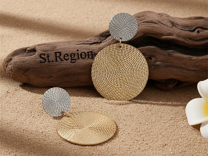 18K Gold-Plated & Silver-Plated Woven Disk Drop Earrings from St.Region photographed for the article Drop vs Minimalist Earrings: How to Choose.