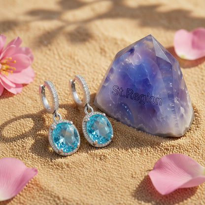 Sea Blue Crystal and Silver-Plated Halo Oval Drop Earrings, silver huggie earrings, everyday style, detail close-up