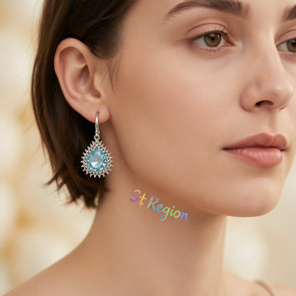Blue Crystal and Silver-Plated Pear-Cut Halo Drop Earrings, silver huggie earrings, botanical inspired, styled look