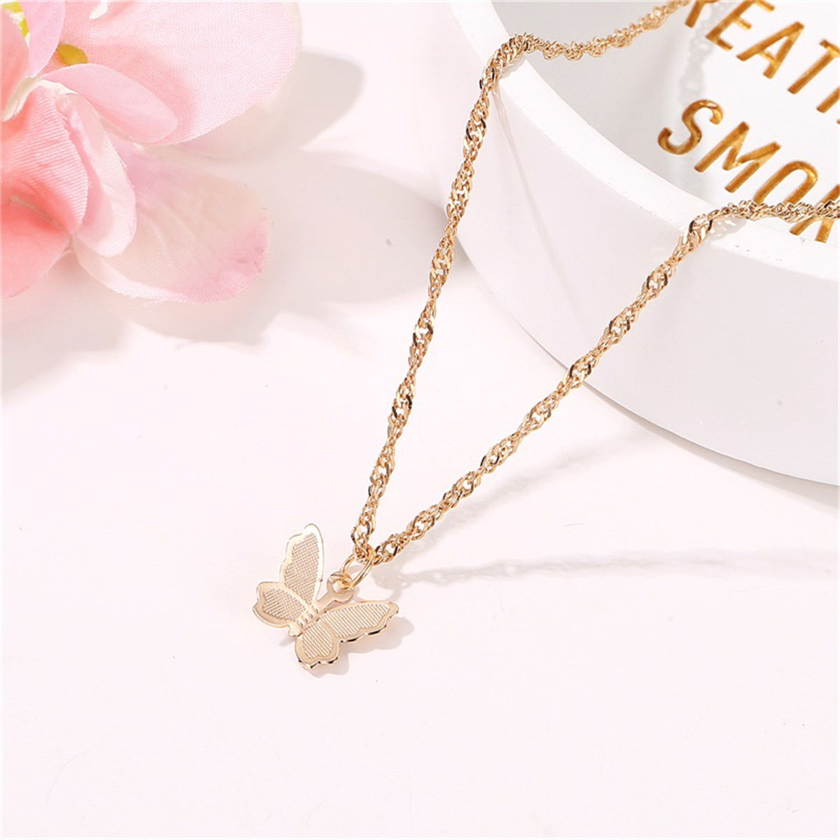 Elegant 18K gold-plated butterfly choker necklace, perfect for adding a touch of charm to any outfit.