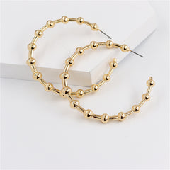 Elegant 18K gold-plated hoop earrings adorned with delicate beads, perfect for adding a touch of sophistication to any outfit.