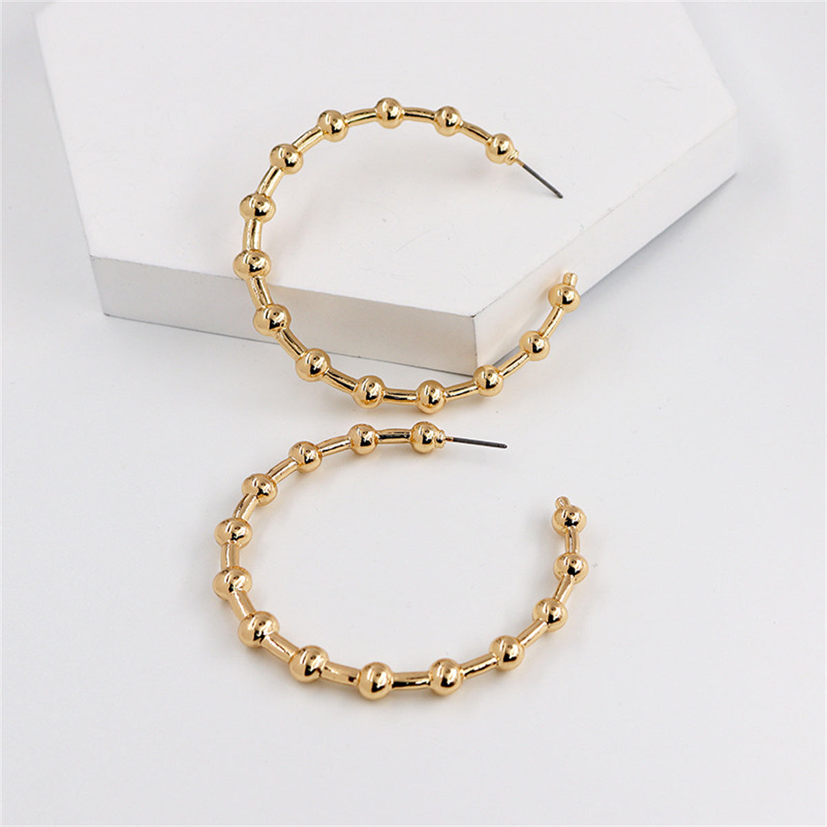 Beautiful 18K gold-plated hoop earrings embellished with small beads, ideal for enhancing your jewelry collection with elegance.
