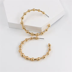Beautiful 18K gold-plated hoop earrings embellished with small beads, ideal for enhancing your jewelry collection with elegance.