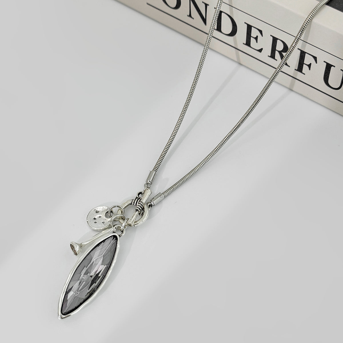 Marquise Crystal and Silvetone Pendant Toggle Necklace, botanical inspired, detail close-up
