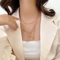 Delightful smiley face necklace with a gold chain, showcasing an 18K gold-plated 'I Love You' charm for a playful touch.