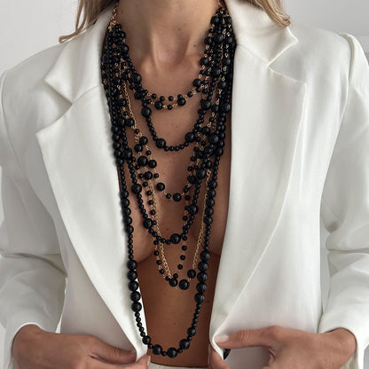 Black Resin and Goldtone Multi-Strand Statement Necklace, botanical inspired, lifestyle look