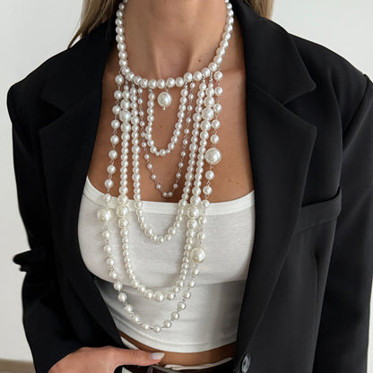 Pearl and Silvertone ‌Graduated Bead Tassel Statement Necklace, dainty minimalist design, styled look