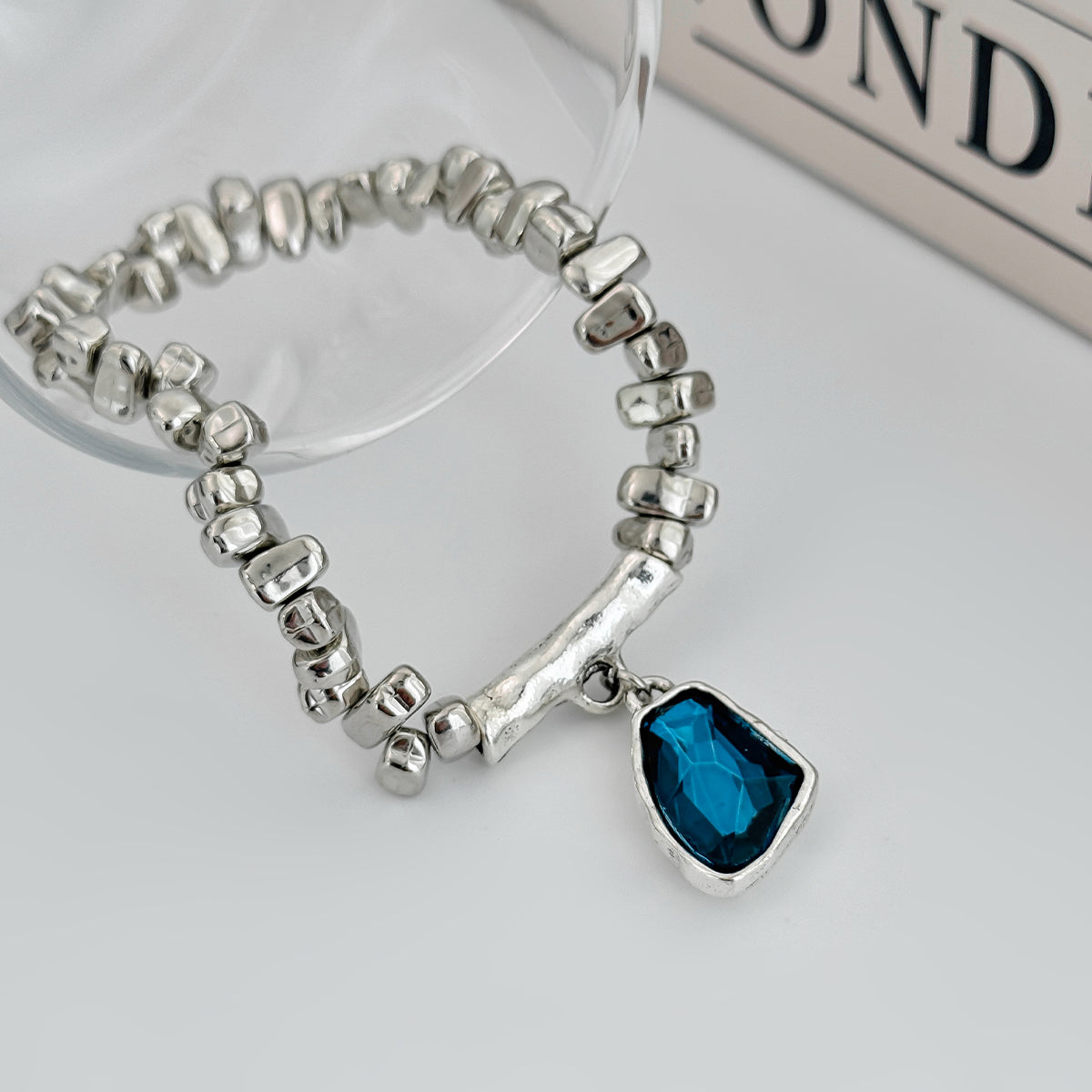 Teal Crystal and Silvertone Beads Irregular Charm Stretch Bracelet, botanical inspired, detail close-up