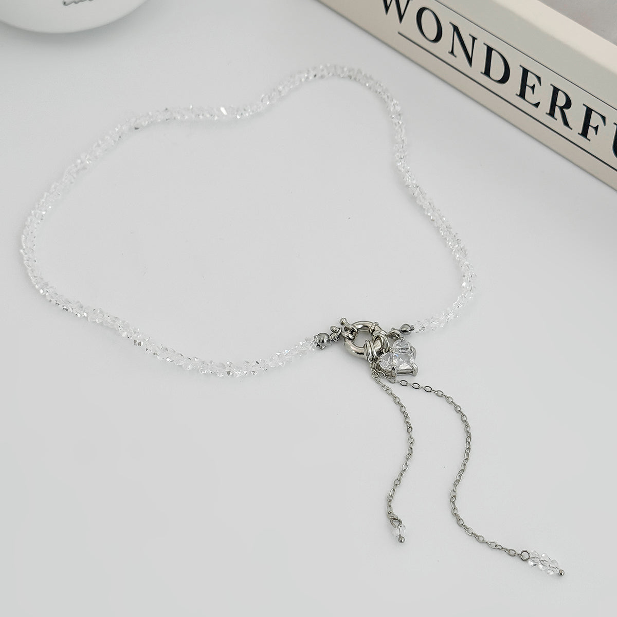 Clear Crystal and Acrylic Silvertone Heart Pendant Tassel Toggle Necklace, vintage-inspired design, side view
