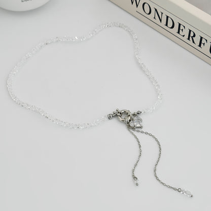 Clear Crystal and Acrylic Silvertone Heart Pendant Tassel Toggle Necklace, vintage-inspired design, side view