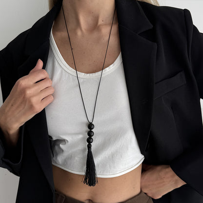 Black Resin and Polyster Tassel Necklace, botanical inspired, lifestyle look