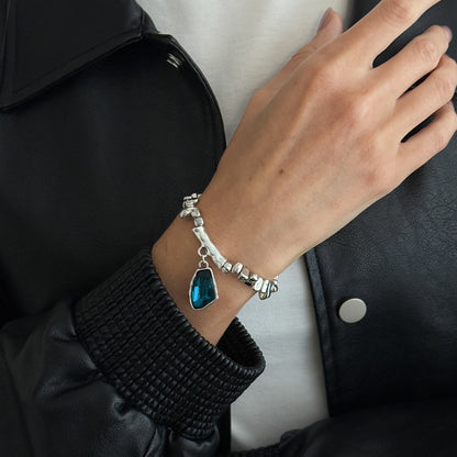 Blue Crystal and Silvertone Beads Irregular Charm Stretch Bracelet, botanical inspired, lifestyle look