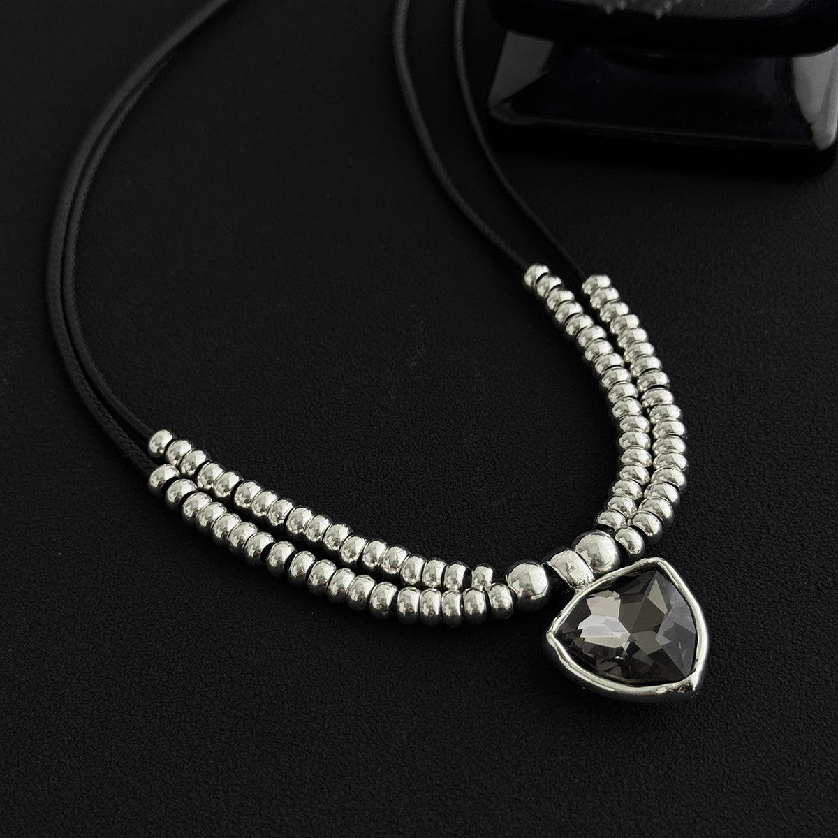 Black Polyster and Crystal Silvertone Beaded Triangle Pendant Necklace, botanical inspired, detail close-up