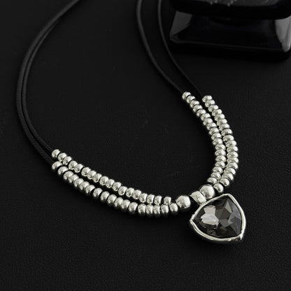 Black Polyster and Crystal Silvertone Beaded Triangle Pendant Necklace, botanical inspired, detail close-up