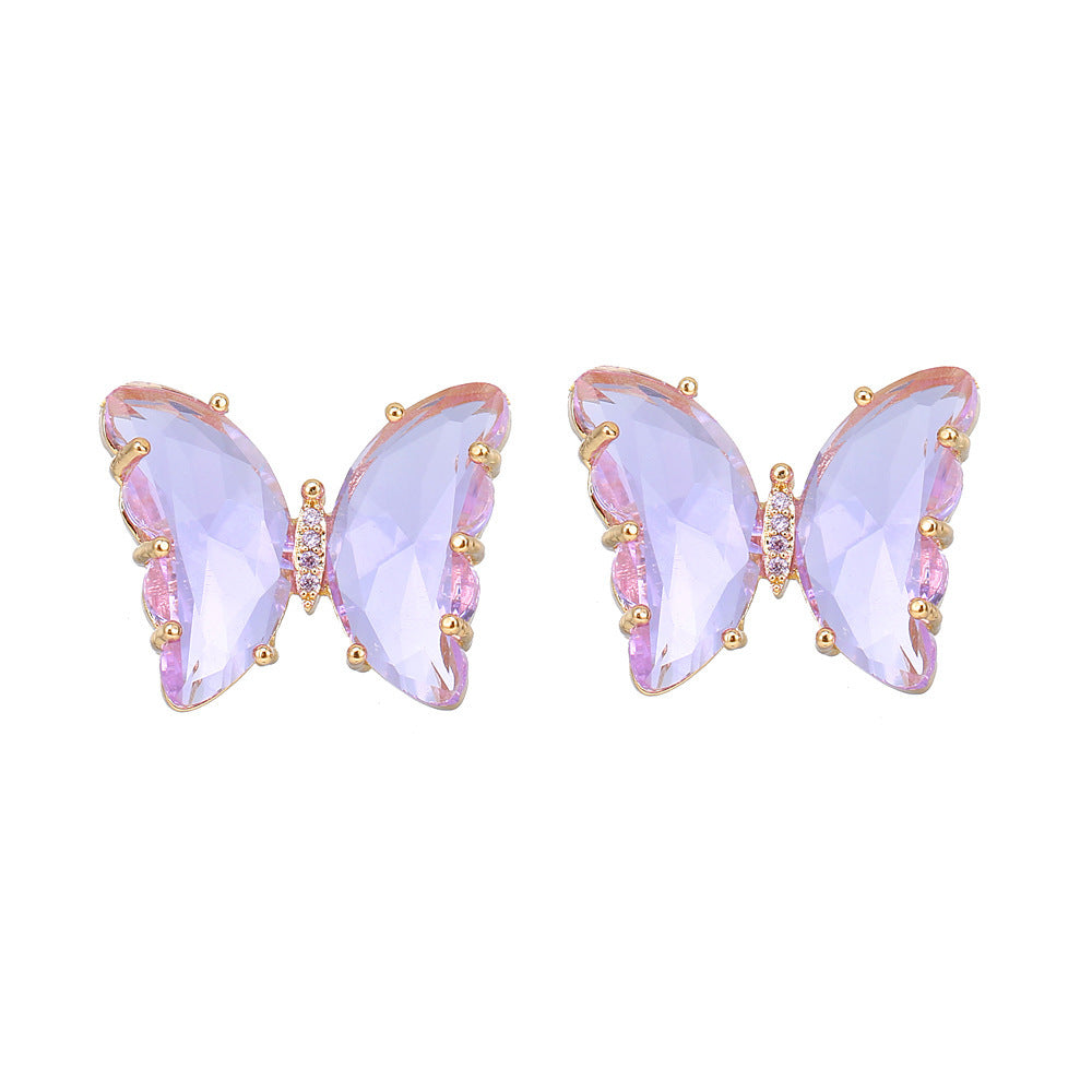 Beautiful butterfly earrings featuring rose gold-plated details and purple crystals, perfect for any occasion.