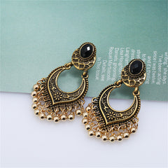 Stunning 18K gold-plated drop earrings with black stones and beads, showcasing a chic bell-tassel design.