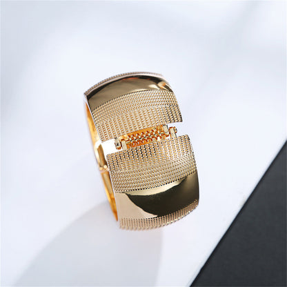 18K Gold-Plated Embossed Wavy Pattern Bangle, gold bangle bracelet, vintage-inspired design, lifestyle look