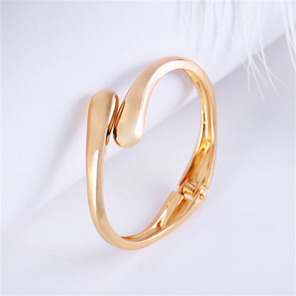 18K Gold-Plated Drop Bypass Hinge Bangle, gold bangle bracelet, botanical inspired, side view
